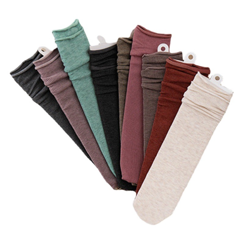 Otoño e invierno nuevos calcetines de rayas retro calcetines de algodón de media pantorrilla de color sólido japonés para mujer ins JK calcetines de mujer al por mayor