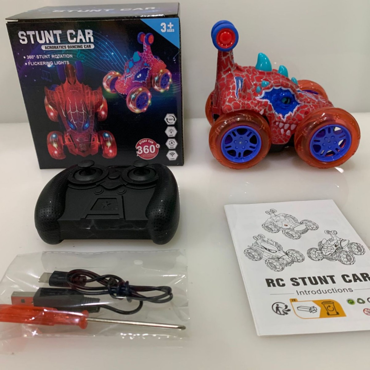 Transfronterizos niños dinosaurios eléctricos 2.4g iluminación música truco camión rodante coche de juguete animal coche de control remoto