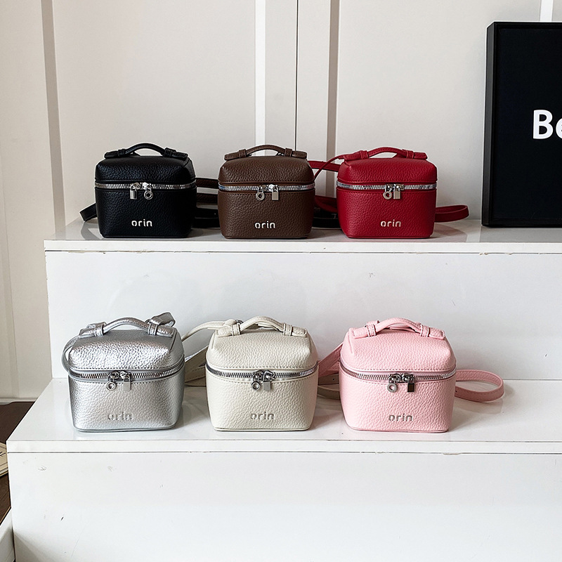 2026 nuevo bolso infantil coreano litchi patrón bolso de caja para hombres y mujeres bolso de cambio de color sólido mini