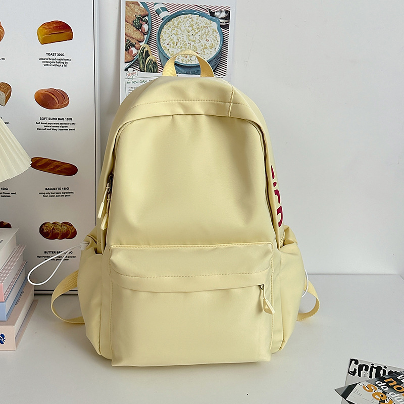 Mochila de gran capacidad para estudiantes de secundaria femenina simple y versátil para estudiantes de secundaria japonesa mochila de diseño