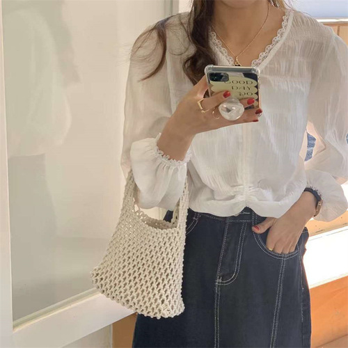 Korean style hollow mesh clutch bag, hand-woven cotton rope wrist bag, fashionable and versatile beach vacation bucket bag