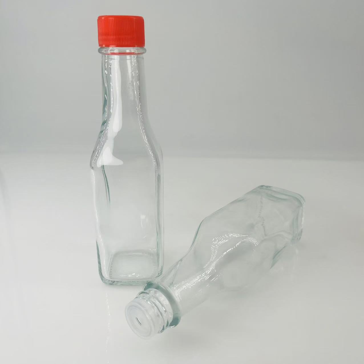 Innovadora botella de salsa de ensalada de cocina cuadrada de 150ml botella de salsa de tomate botella de salsa de ensalada botella de jugo de espino amarillo botella de vidrio grueso