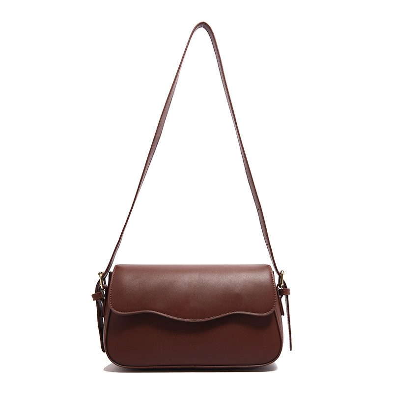 Bolsa de hombro de temperamento para mujeres 2024 otoño nuevo estilo de moda textura mochila de diseño artístico simple bolso de brazo