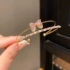 Golden fuchsia bracelet with bow