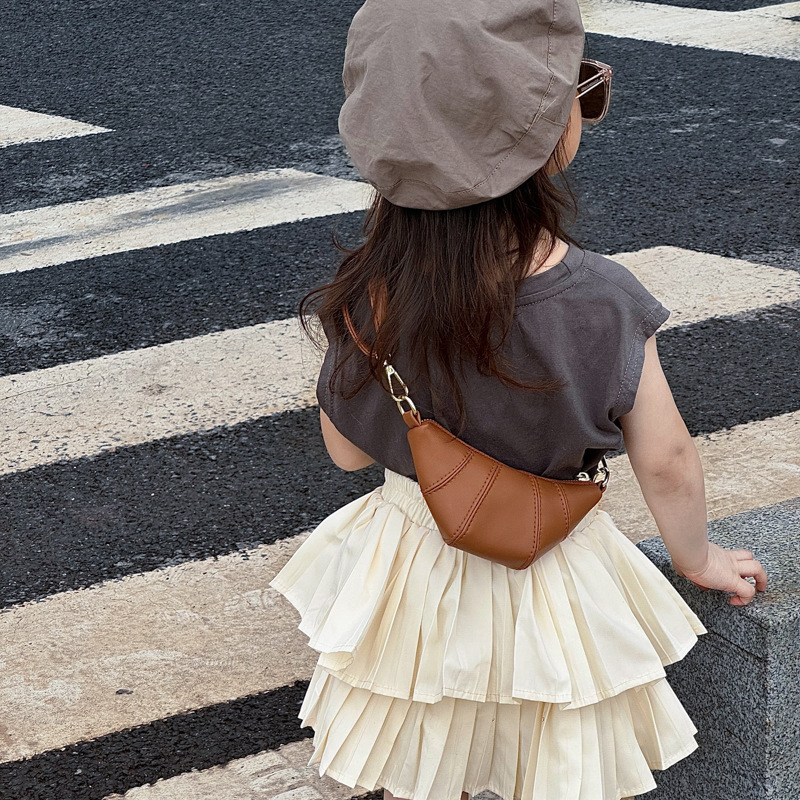 Bolsa de hombro coreana para niños y niñas, moda de color sólido creativa, forma de cuerno de buey, bolso para niños, nuevo tipo de bolso para niños de comercio exterior