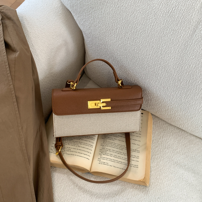 Cross-border retro bolsos europeos y estadounidenses mujeres 2026 nuevo nicho super caliente Kelly bolsa de viaje ocio mochila pequeña