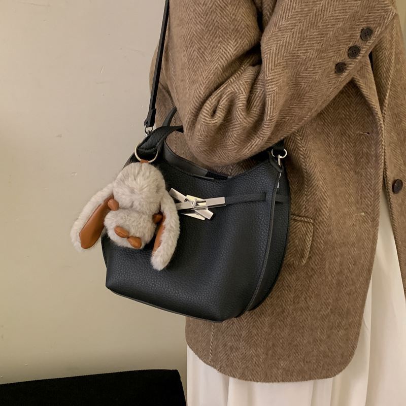 Bolsa de cubo de mano para mujeres 2025 nuevo otoño invierno retro bolso de hombro Kelly sensación de alta calidad de trabajo viaje mochila