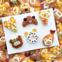 ベアーのドーナツのパンのアクセサリーの部品を食べます。