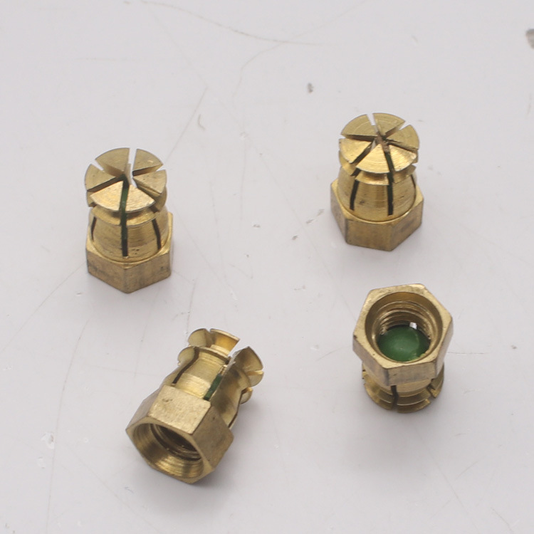Tuerca de cobre expandida de fábrica M4 muebles hexagonales piezas de conexión cuatro en uno tuerca incrustada bisagra piezas incrustadas de cobre