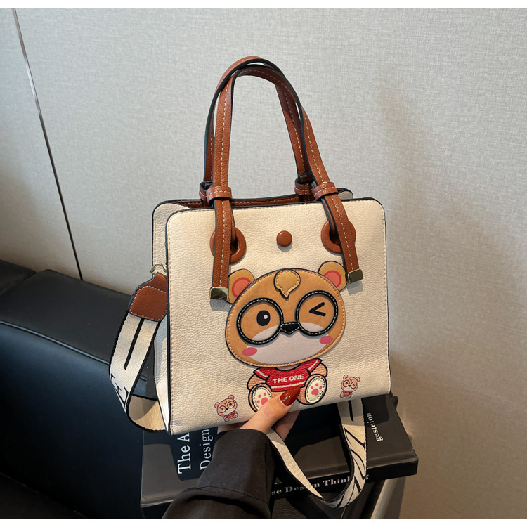 Bolso Tote transfronterizo para mujer de gran capacidad 2025 nuevo bolso bandolera de banda ancha salvaje de verano bolso de clase portátil de ocio