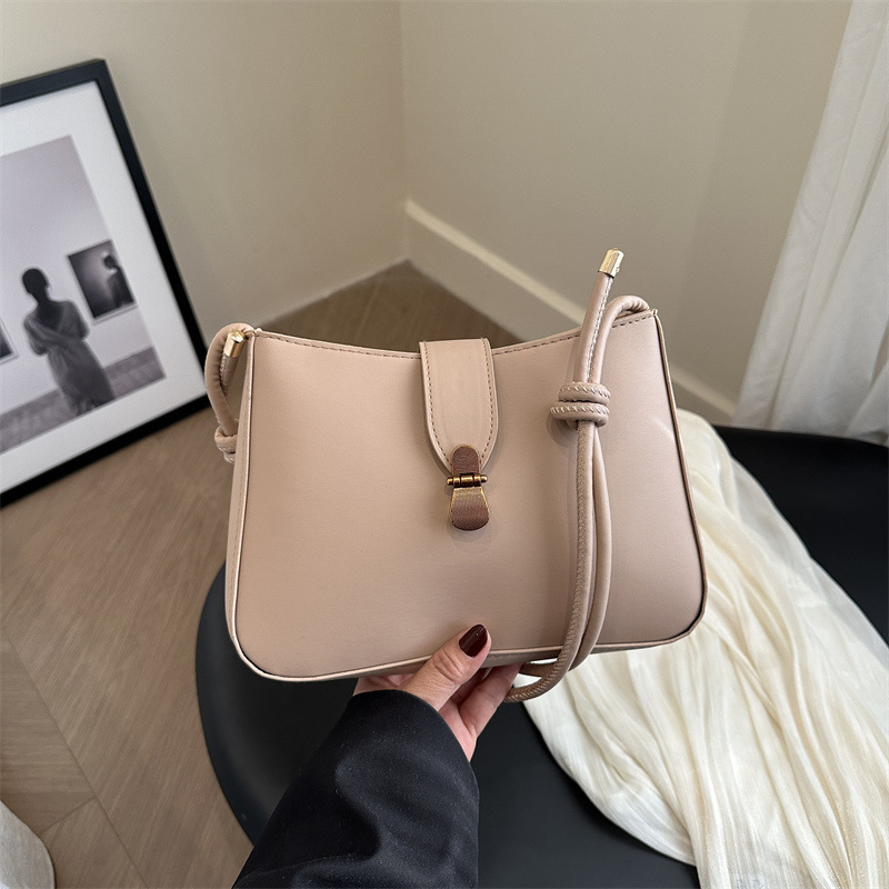 Bolsa de brazo retro para mujeres 2025 primavera nueva bolsa de moda pequeña bolsa de viaje coreana simple bolsa de hombro extranjera