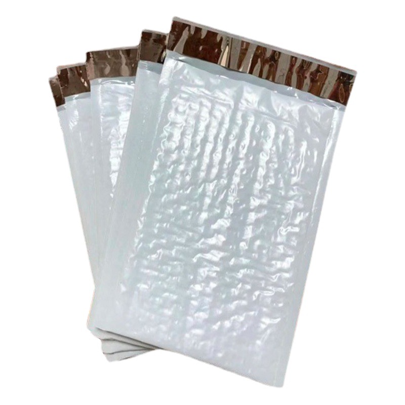 En stock bolsa de burbuja de película coextruida engrosada ropa impermeable bolsa de embalaje expreso bolsa de espuma de película de burbuja compuesta al por mayor