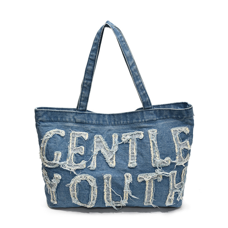 Bolsa de denim de gran capacidad para mujeres 2024 temperamento retro ocio clase de viaje de hombro inclinado bolso inferior