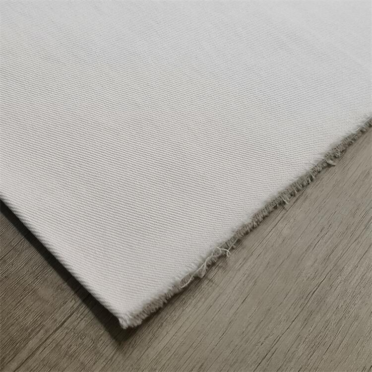 Fabricante al por mayor micro elástico tela de spandex de twill 250gsm pantalones blancos tela elástica de algodón de twill cómodo superficie de spandex