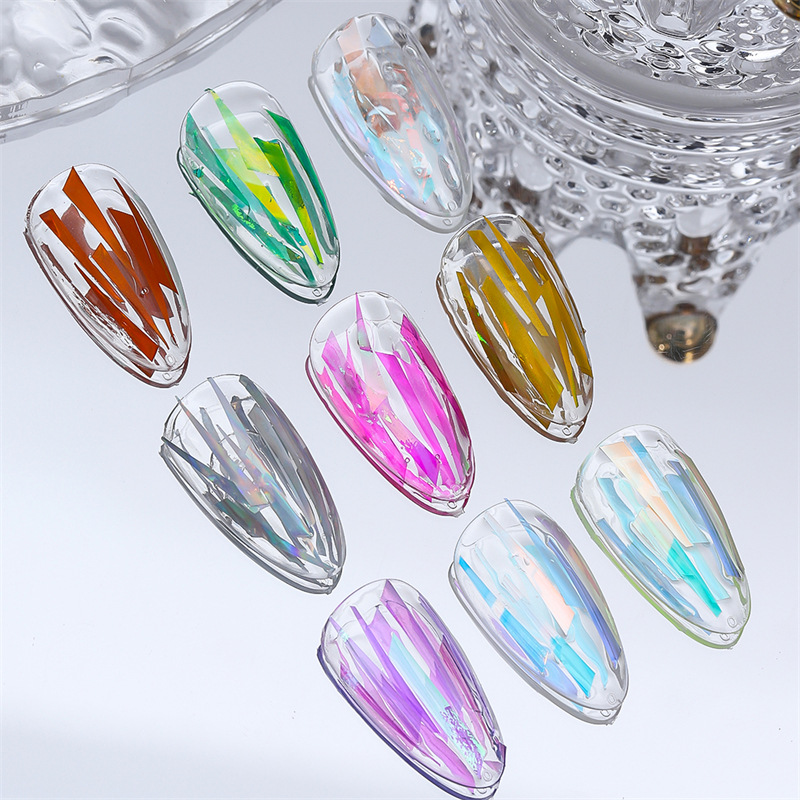 Arte de uñas Aurora duende fragmentos celofán irregular láser japonés Internet celebridad pegatinas Corte libre de uñas al por mayor