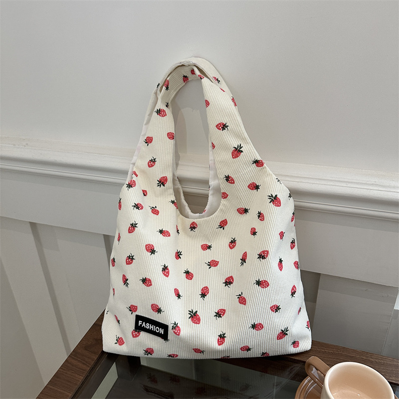 Bolso de meandruño 2024 nuevo hombro de gran capacidad bolso de mano de transporte literario versátil impresión brazaleta