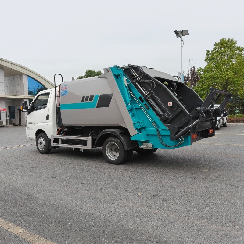Pure electric sanitation vehicle with a sealed garbage compactor, designed for automatic compression of municipal solid waste for collection and transportation