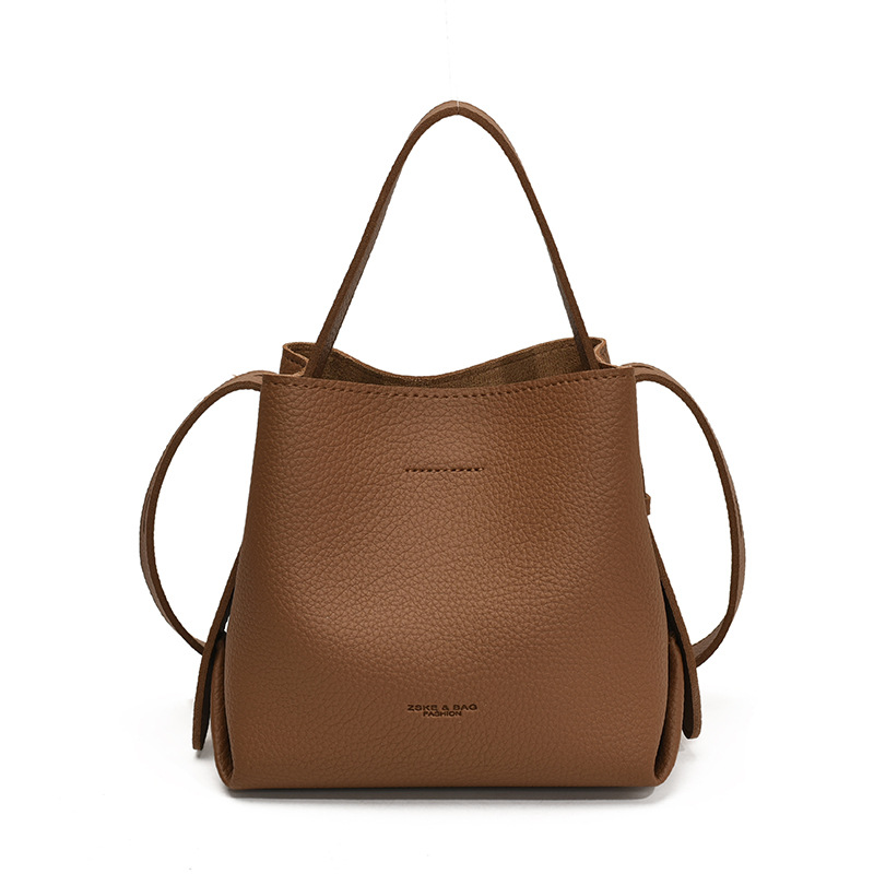 Bolso de mano de alta sensación, bolso de cubo de gran capacidad para mujeres, otoño y invierno 2025, nuevo estilo de moda bolso de hombro, bolso de mochila versátil