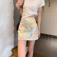 小さい花の半身のスカートの女性の夏の高腰はやせているa字のスカートの小さい大衆の独特な油絵のスカートはヒップのスカートを包んでスカートを合わせます。