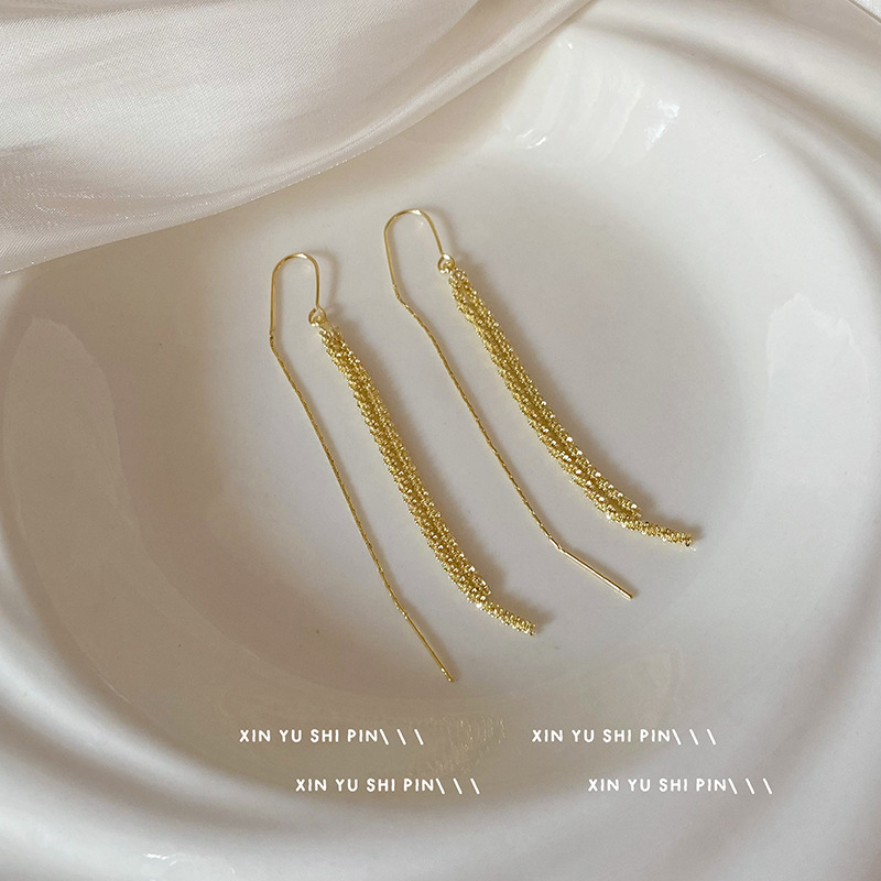 Brillante aretes de tetas de estrellas 2024 nueva personalidad temperamento de alta sensación de aretes largos tirando de aretes explosivos
