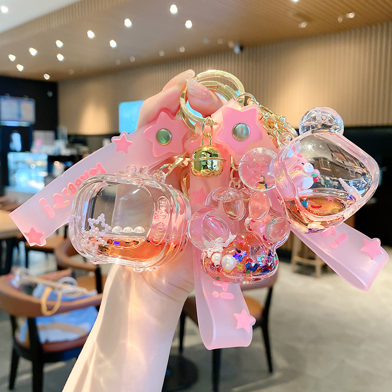 Linda bolsa de fresa de aceite llavero de conejo exquisito colgante de botella de deriva colgante de bolsa de coche colgante pequeño regalo al por mayor