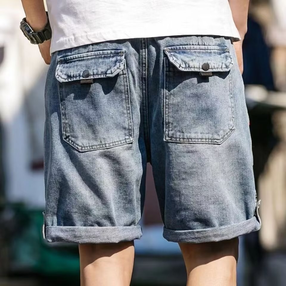 Pantalones cortos de mezclilla de comercio exterior para hombre, novedad de verano, estilo coreano, marca de moda, cintura semielástica, pantalones de cinco cuartos rizados con botones sueltos de talla grande