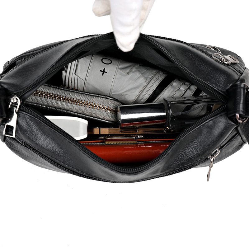 Korkealaatuinen, monikerroksinen naisten pehmeästä nahasta valmistettu laukku vuodelta 2024, jossa on suuri kapasiteetti ja hyvälaatuinen yksiolkainen diagonaalinen ristikkäislaukku._voghion.com