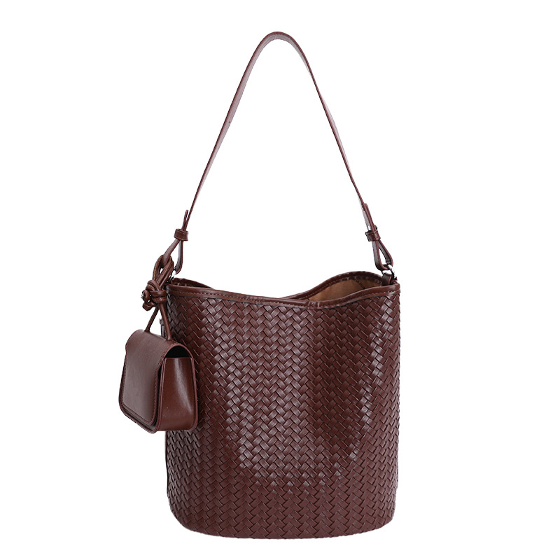 Diseño coreano de nicho de tejido bolso de cubo de agua de mujer nueva textura de alta calidad de hombro versátil bolso de tramo inclinado