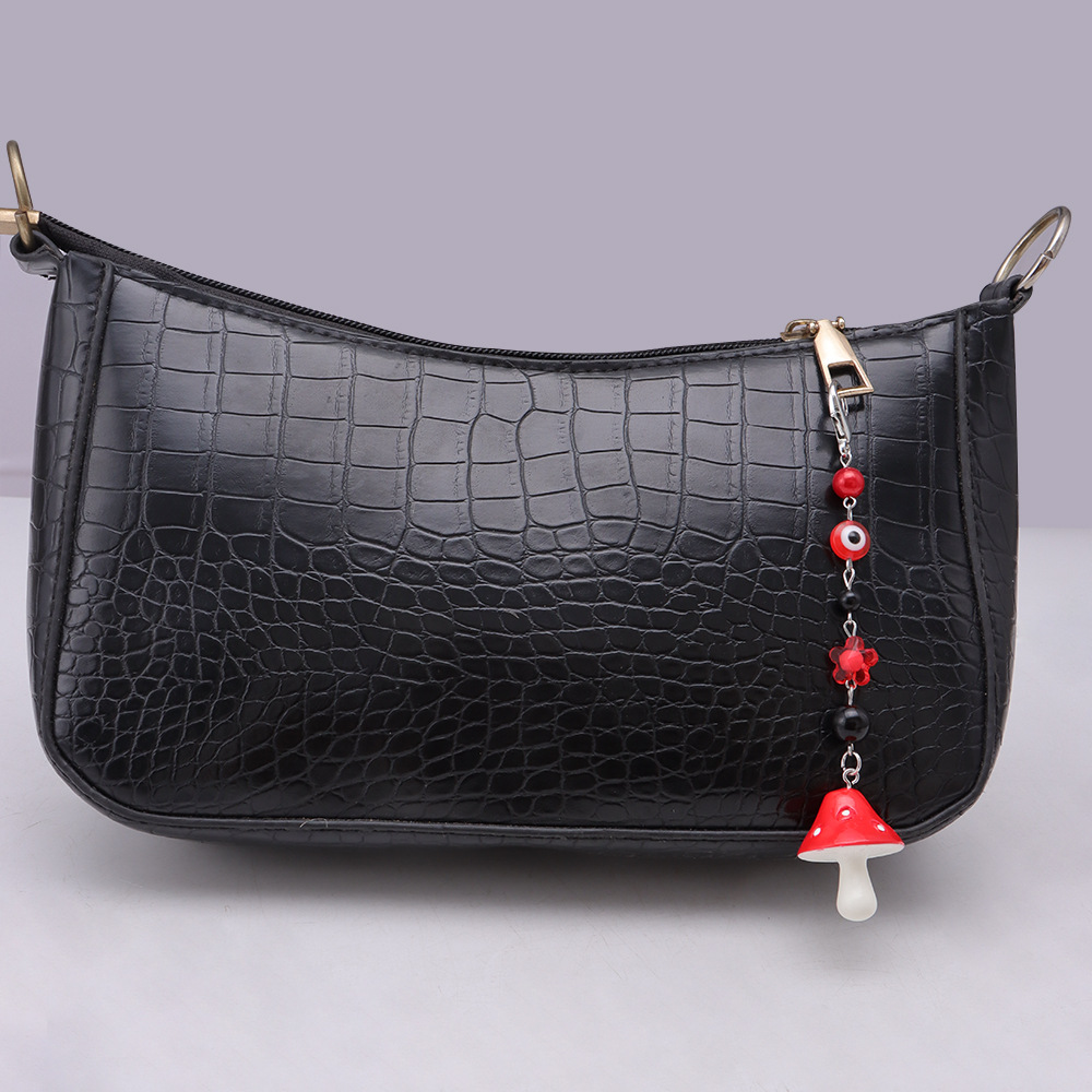 La versión coreana transfronteriza de la joyería de llavero de setas de color, la resina de dibujos animados, el ojo creativo del diablo, el bolso, el colgante de accesorios