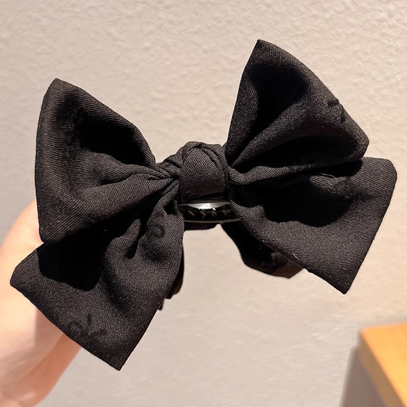 Clip de mariposa negro