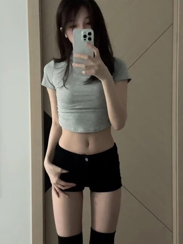 ギャルの黒い腰の低いデニムのショートパンツの女子学生の夏の新型のアメリカのレトロな弾力のガードルのお尻の熱いズボンの潮を包みます。|undefined