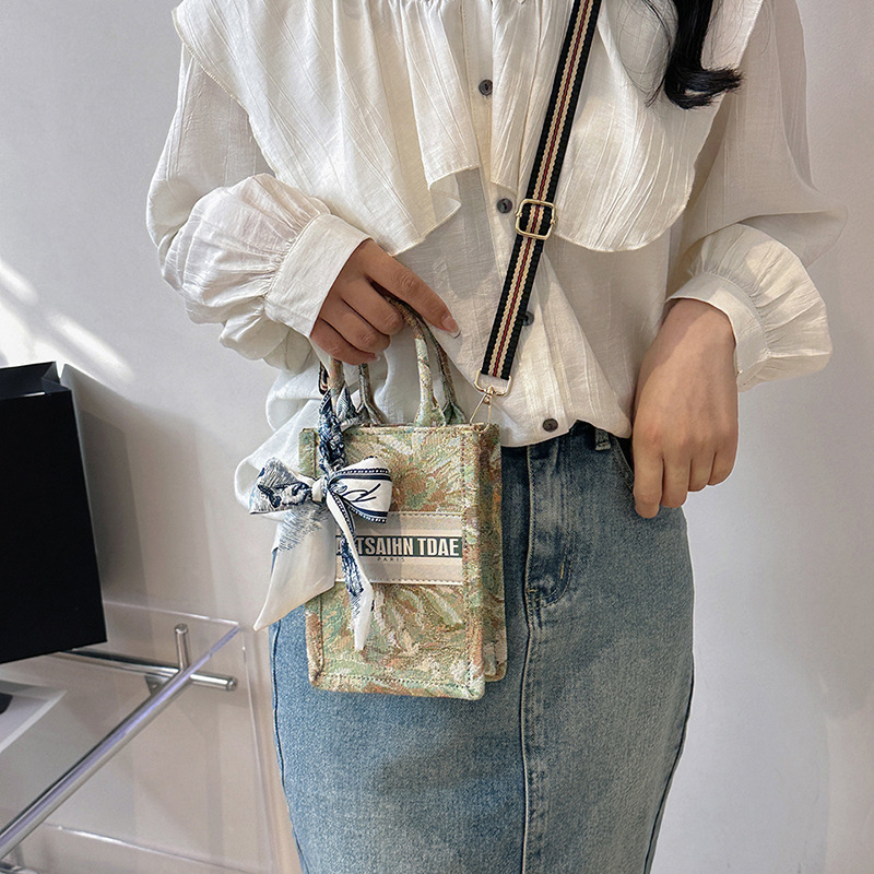 Bolso pequeño para mujer, nuevo bolso de mano vertical personalizado de moda europea y americana, bolso cruzado con estampado de lona de nicho
