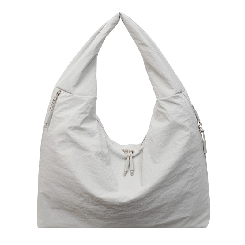 Bolsa de brazo de tela de nylon transfronteriza para mujeres 2025, nueva bolsa de hombro casual simple, bolsa de torneo casual universal