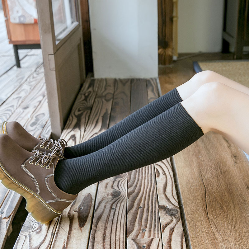 All-color calf socks are versatile for spring and autumn, high-top socks with an Ins-style, fashionable, simple, and autumn-winter high-top half-leg socks for women to look slimmer.