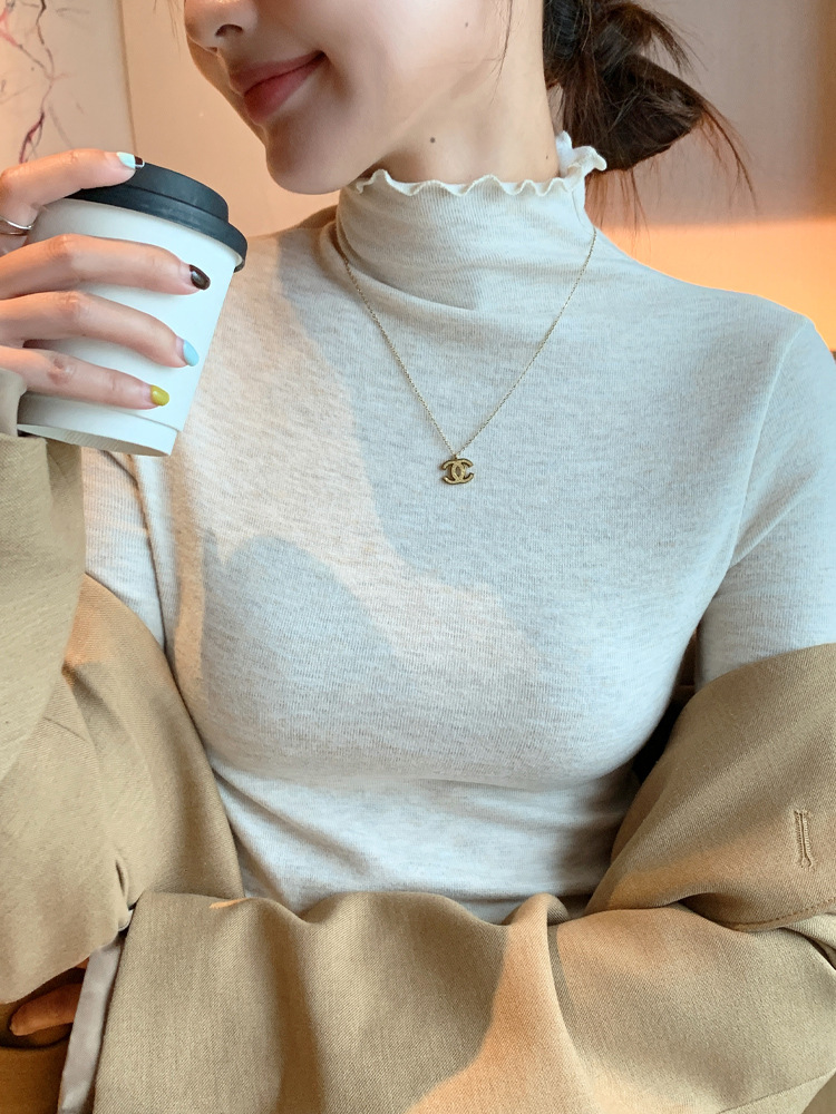 H360は厳選した木の耳元の半高襟の底のシャツの女性の秋冬の中で身を修めるレースのニットの上着を合わせます。