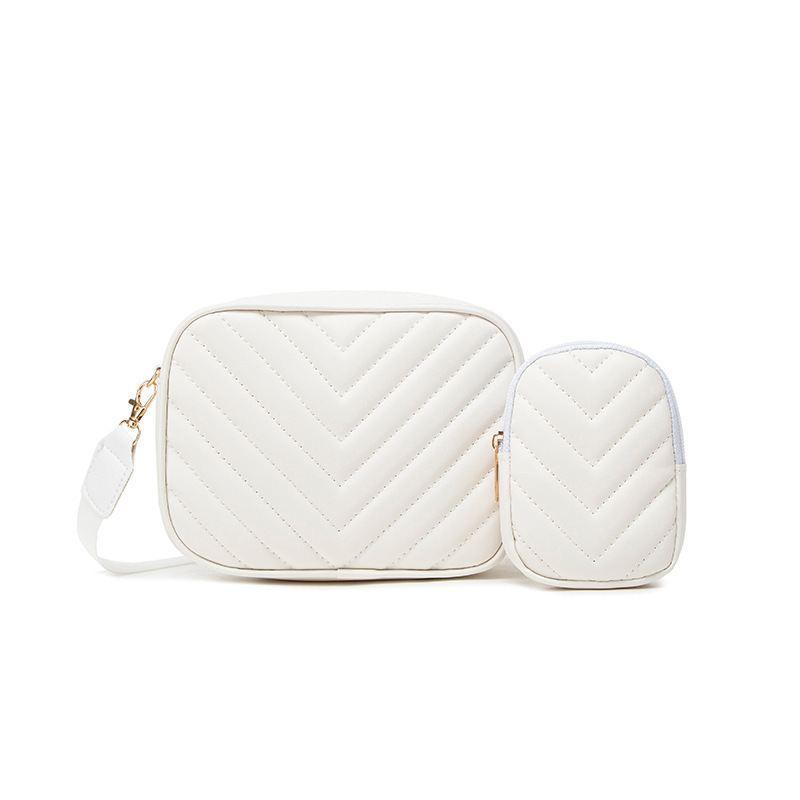 Bolsas de mujer al por mayor transfronterizas 2025 primavera y verano nueva bolsa de moda versátil bolsas de cámara de patrón en V cadena bordada bolsas de mochila