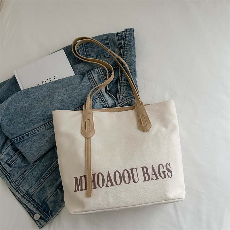 Bolsa de gran capacidad para mujeres 2024 otoño nuevo estilo de bolsa de lona universal bolso de hombro de viaje de estudiantes universitarios bolso de clase