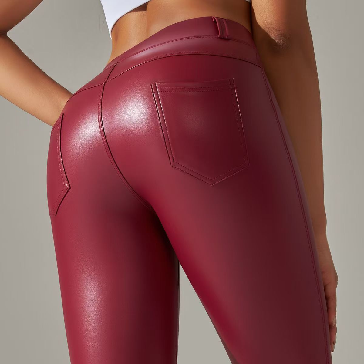 2024 Europa y América Pantalones de cuero PU mujeres de cintura alta ajustados pantalones de bolsillo molido leggings nuevo otoño invierno