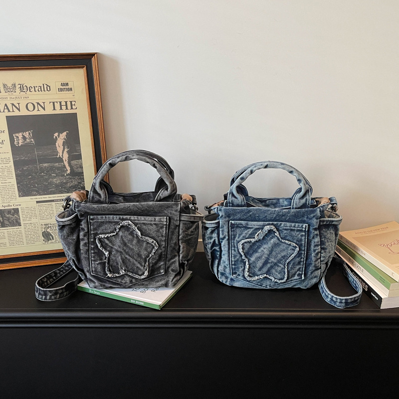 Europa y los Estados Unidos retro vaqueros bolsas de hombro para hombres y mujeres bolsas de estrellas portátiles ligeras y casuales 2026 nueva versión coreana bolsas para niños