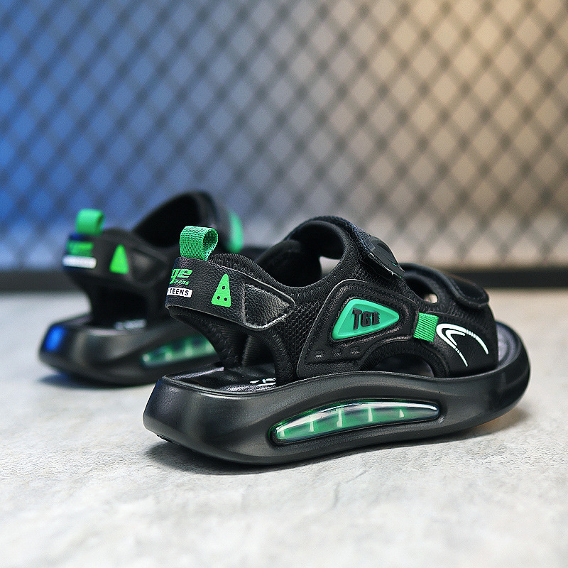 Nuevas sandalias 2025 zapatos de playa de verano masaje suela suave partículas al por mayor antideslizante cojín de aire de playa para niños