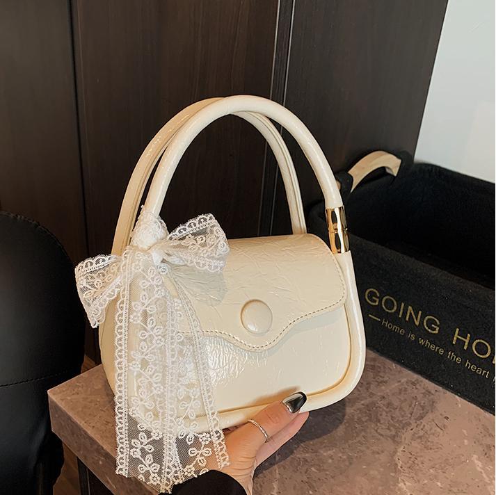 Bolso cuadrado pequeño estilo explosivo único exterior para mujer 2025 nuevo bolso de mensajero simple de color en contraste cuero de cera de aceite bolso de hombro todo fósforo de nicho