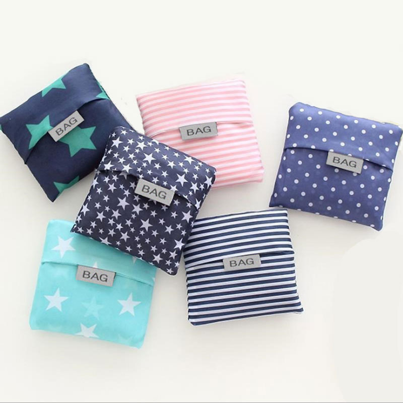 Handheld folding shopping bag