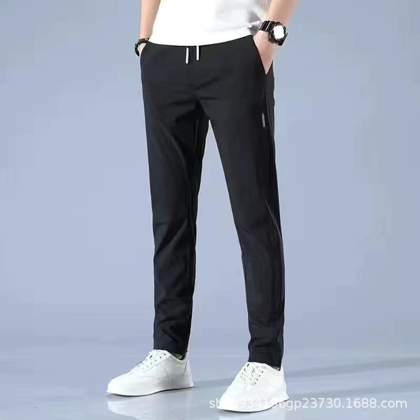 Thin black trousers, loose straight fit