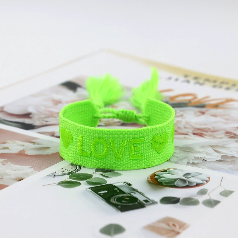 handmade woven bracelet, polyester, embroidered letters with tassels, adjustable (love)