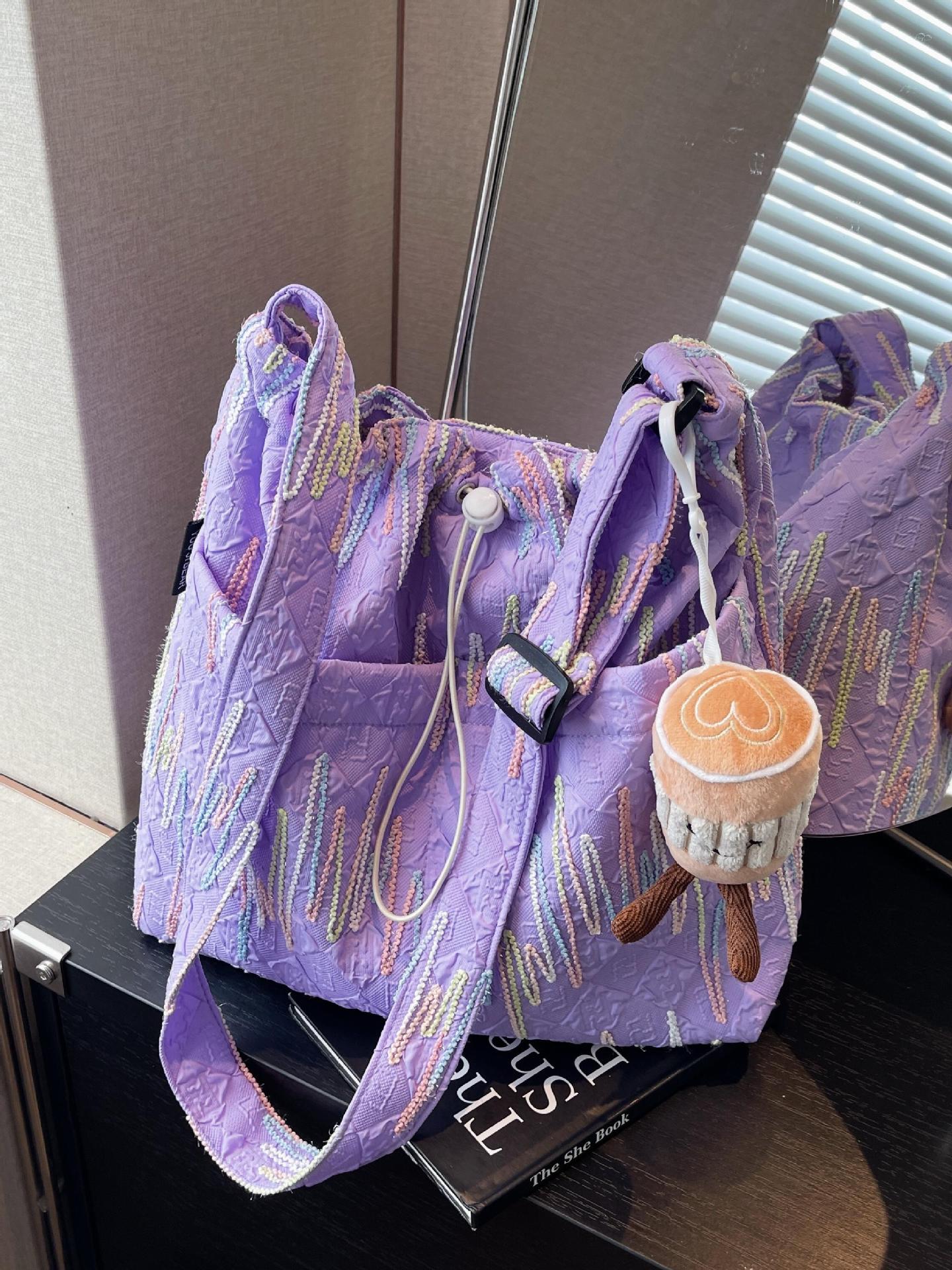 Estilo occidental todo-fósforo bolso de ocio bolso de mensajero mujer 2025 nuevo bolso de cubo de moda simple bolso de lona de viaje para estudiantes