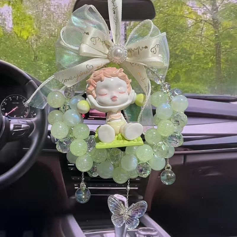 아기를 안고 있는 녹색 깃발 구슬(바람이 불고 있다)