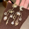 Asymmetrical earrings pearl with tassels