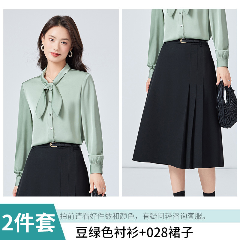 Green shirt, black skirt