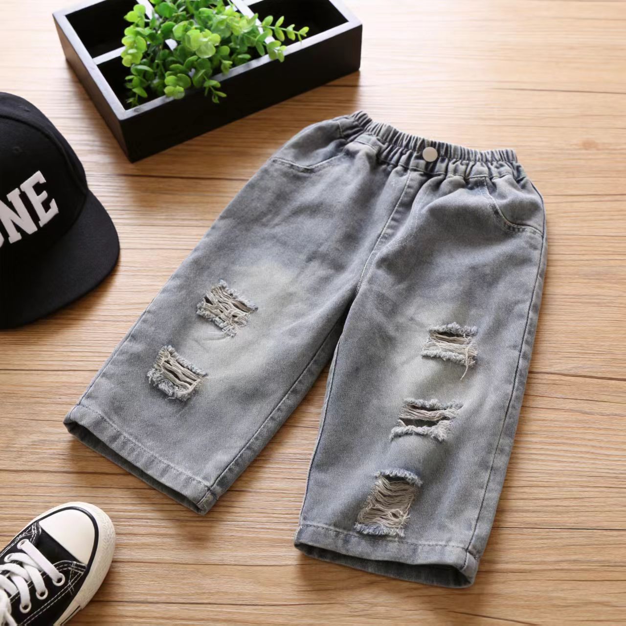 Personalidad extranjera para niños coreanos agujeros jeans para hombres y mujeres bebés coreanos pantalones rectos sueltos pantalones de moda primavera y otoño