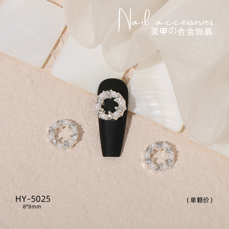 Nuevo arco de uñas amor aleación decoración de uñas flor de la luna mariposa clavo taladro fábrica joyería al por mayor